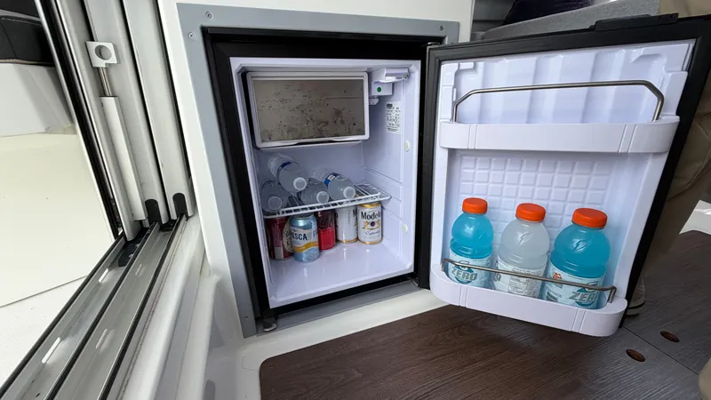 Slide: The Image of Fridge in Jeanneau NC 795 Series 2 boat, stocked with beverages. - 47