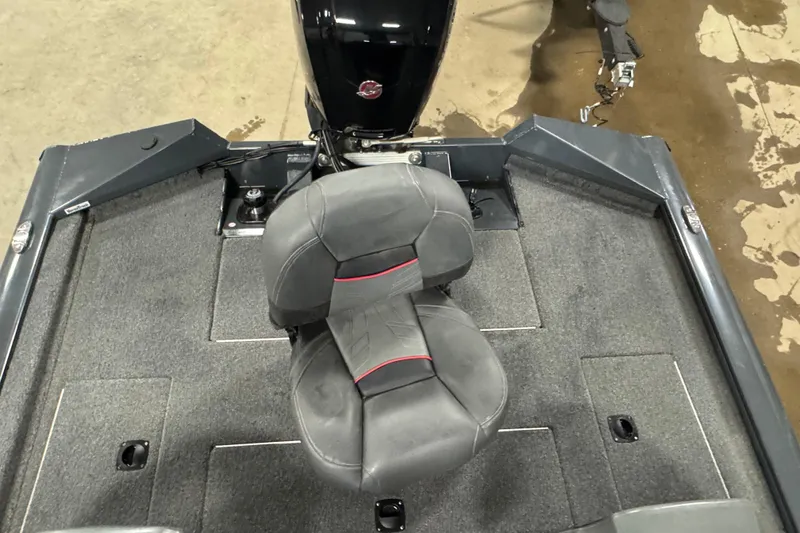 Slide: The Image of 2022 Tracker Pro Team 190 TX boat interior with dual seats and carpeted flooring. - 10