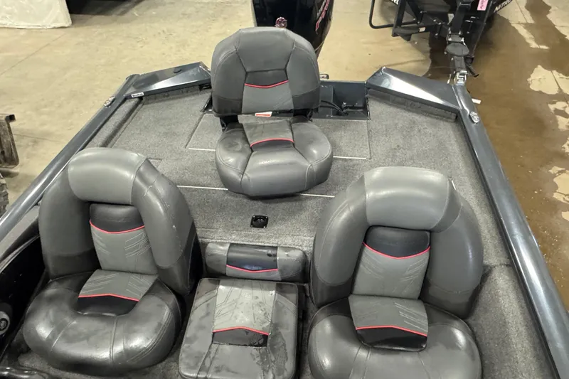 Slide: The Image of 2022 Tracker Pro Team 190 TX boat interior with gray and black seating. - 5