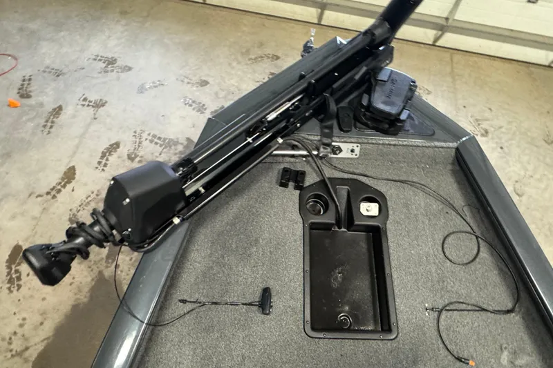 Slide: The Image of 2022 Tracker Pro Team 190 TX boat deck with trolling motor and storage compartment. - 8