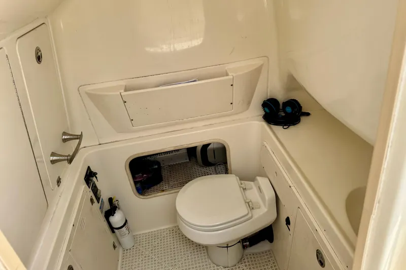 Slide: The Image of 2006 Boston Whaler 320 Outrage Cuddy Cabin with luxurious seating and sleek design. - 10