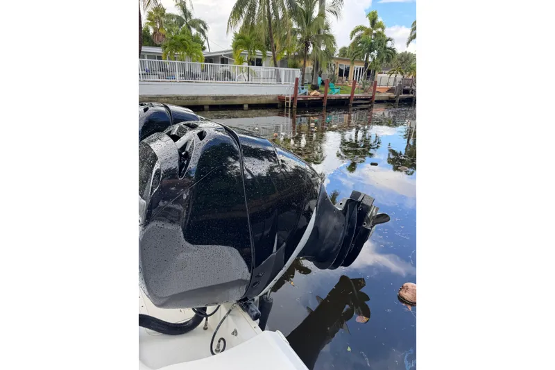 Slide: The Image of 2006 Boston Whaler 320 Outrage Cuddy Cabin bathroom with toilet and sink. - 15