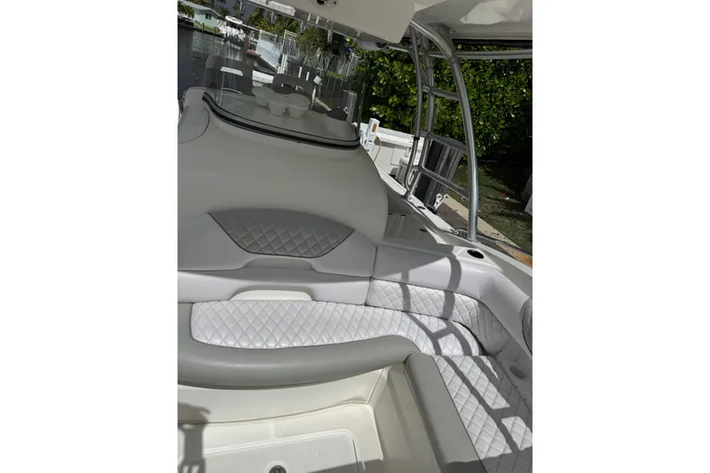 Slide: The Image of 2006 Boston Whaler 320 Outrage Cuddy Cabin helm with steering wheel and control panel. - 6