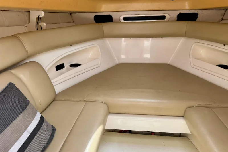 Slide: The Image of 2006 Boston Whaler 320 Outrage Cuddy Cabin helm with steering wheel and navigation controls. - 7