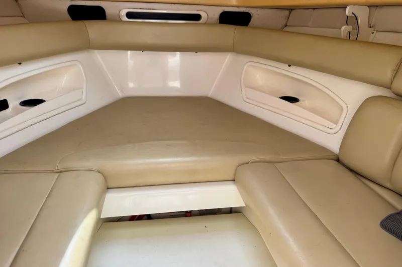 Slide: The Image of 2006 Boston Whaler 320 Outrage Cuddy Cabin helm with steering wheel and navigation equipment. - 8