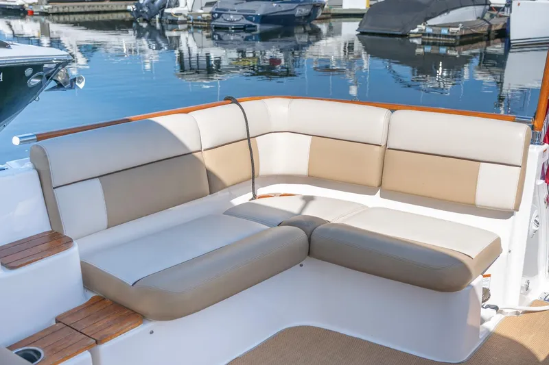 Slide: The Image of 2014 Tiara Yachts 3100 Coronet interior with elegant seating and wooden table. - 11