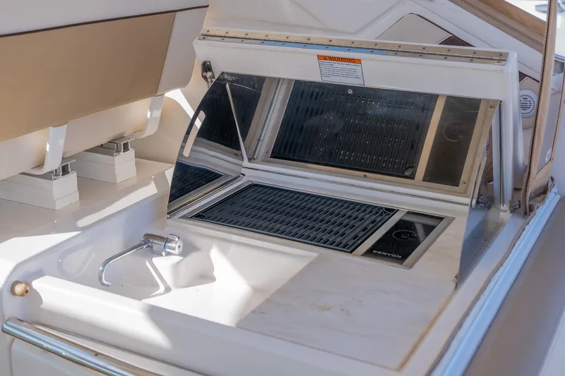 Slide: The Image of Interior view of 2014 Tiara Yachts 3100 Coronet, showcasing helm and navigation equipment. - 27