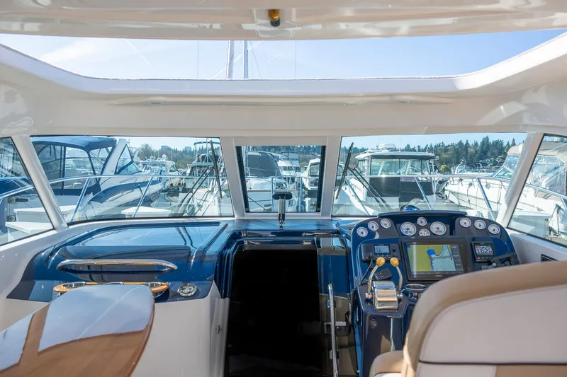 Slide: The Image of 2014 Tiara Yachts 3100 Coronet interior with helm and seating area. - 28