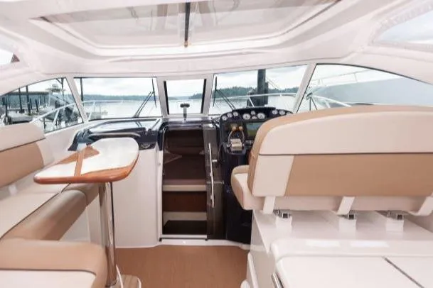 Slide: The Image of Luxurious interior of 2014 Tiara Yachts 3100 Coronet, featuring elegant seating. - 32