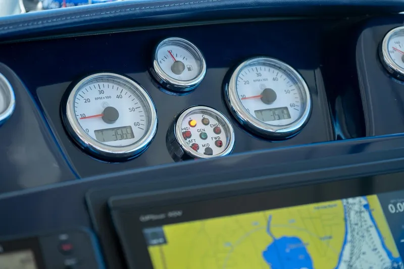 Slide: The Image of Helm controls of 2014 Tiara Yachts 3100 Coronet with wooden steering wheel and throttle levers. - 36