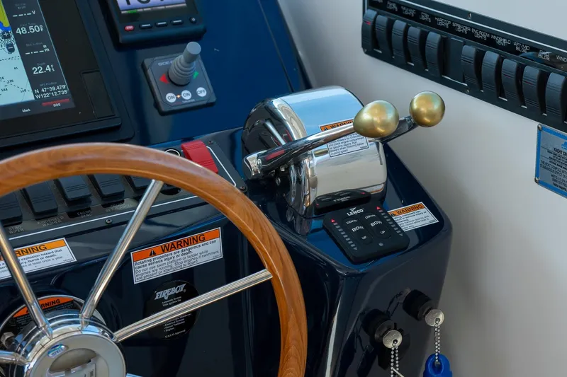 Slide: The Image of Control panel of 2014 Tiara Yachts 3100 Coronet with steering wheel and navigation equipment. - 37