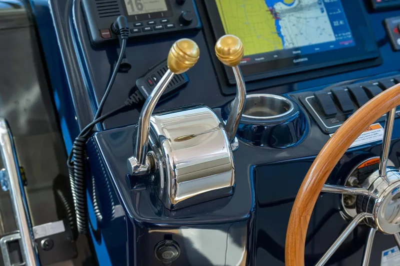 Slide: The Image of Control panel of a 2014 Tiara Yachts 3100 Coronet with labeled switches and buttons. - 38