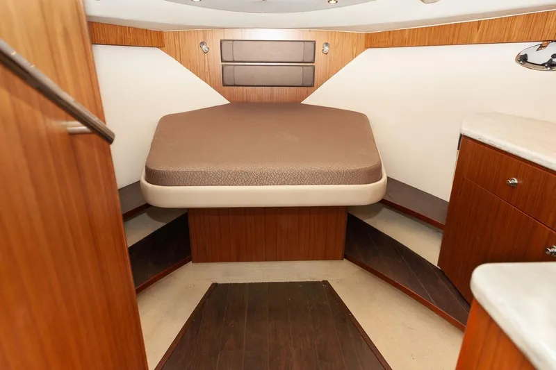 Slide: The Image of Luxurious cabin interior of 2014 Tiara Yachts 3100 Coronet with elegant wood finish. - 42