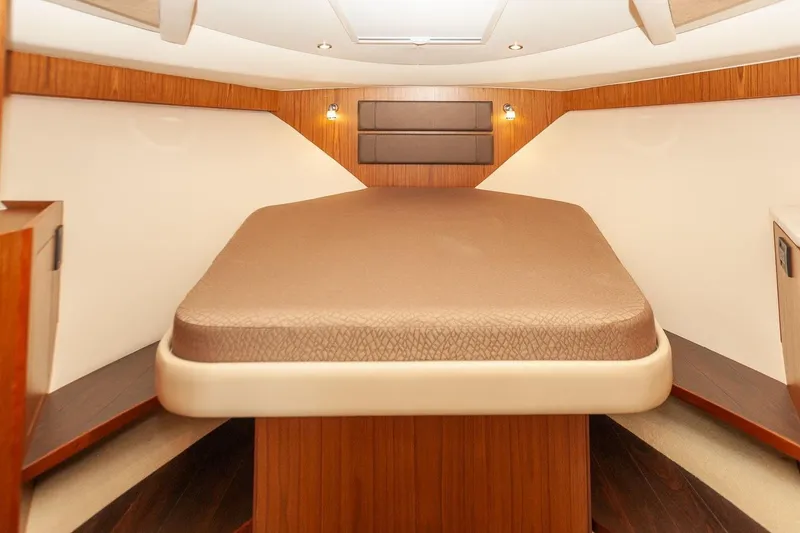 Slide: The Image of 2014 Tiara Yachts 3100 Coronet interior with kitchenette, sink, and microwave. - 43