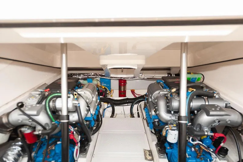 Slide: The Image of Engine compartment of a 2014 Tiara Yachts 3100 Coronet, showcasing detailed mechanical components. - 52