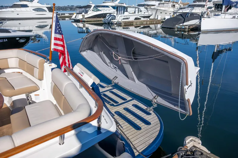 Slide: The Image of 2014 Tiara Yachts 3100 Coronet docked at marina, clear blue sky background. - 54