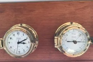Slide: The Image of Brass clock and barometer on 1996 Nordic Tug 32 wooden panel. - 14