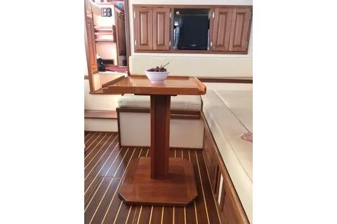 Slide: The Image of Interior of 1996 Nordic Tug 32 with wooden table and seating area. - 20