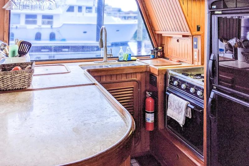 Slide: The Image of Cozy 1990 Hans Christian Independance yacht kitchen with wooden cabinetry and modern appliances. - 10