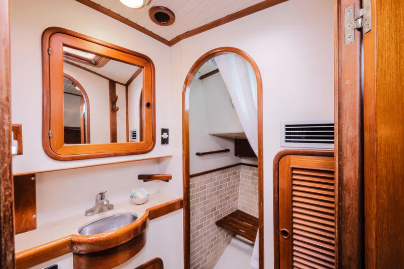 Slide: The Image of 1990 Hans Christian Independance yacht bathroom with wooden accents and compact design. - 15
