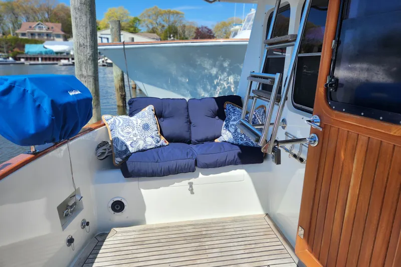 Slide: The Image of Cozy seating area on 1990 Hans Christian Independance yacht with blue cushions and nautical decor. - 24