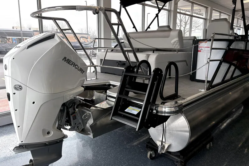 Slide: The Image of 2026 Crest 235 SLSC CONQUEST pontoon boat with Mercury engine in showroom. - 3