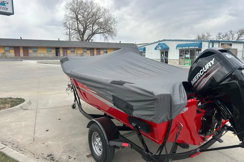 Slide: The Image of 2016 Tracker Pro Guide V-16 SC boat with cover and Mercury outboard motor. - 10