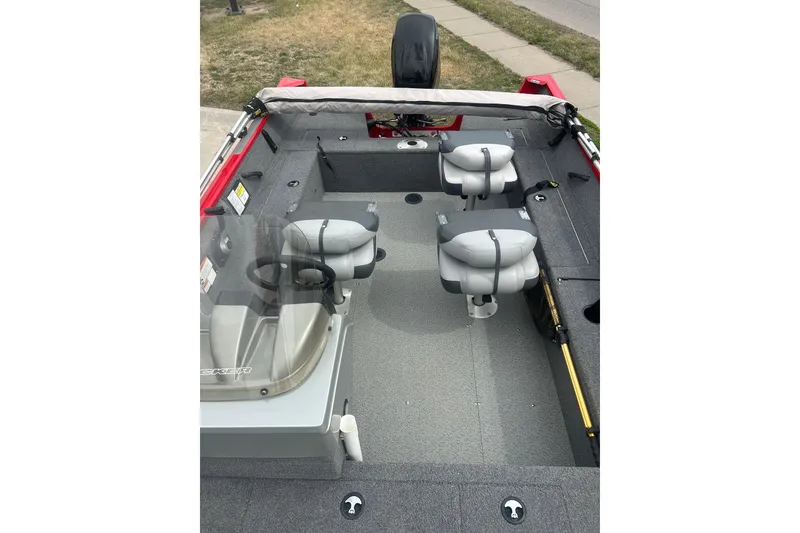 Slide: The Image of 2016 Tracker Pro Guide V-16 SC boat interior with seating and steering console. - 14