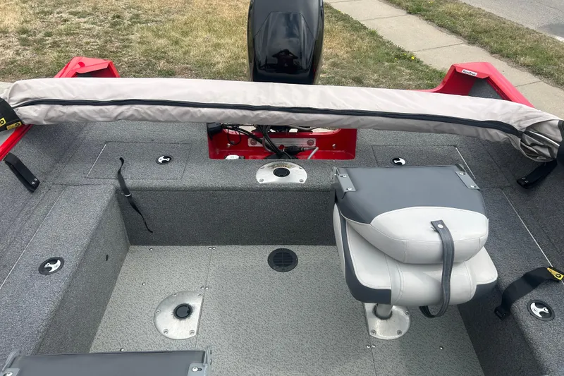 Slide: The Image of 2016 Tracker Pro Guide V-16 SC boat interior with seating and storage compartments. - 17