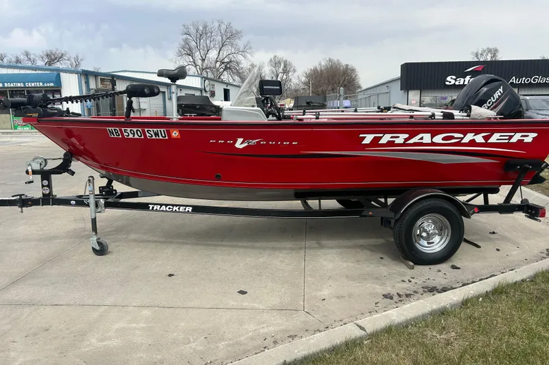 Slide: The Image of 2016 Tracker Pro Guide V-16 SC boat on trailer, parked outdoors. - 3