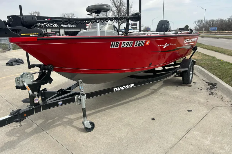 Slide: The Image of 2016 Tracker Pro Guide V-16 SC boat on trailer, parked in a lot. - 5