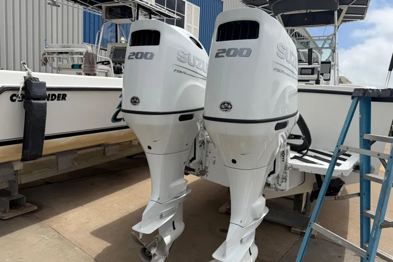 Slide: The Image of Twin Suzuki 200 outboard engines on a 1997 Regulator 26 Center Console boat. - 4