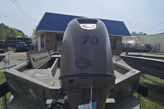 Slide: The Image of 2026 Havoc 1860 DBST boat with 70 HP outboard motor in outdoor setting. - 13