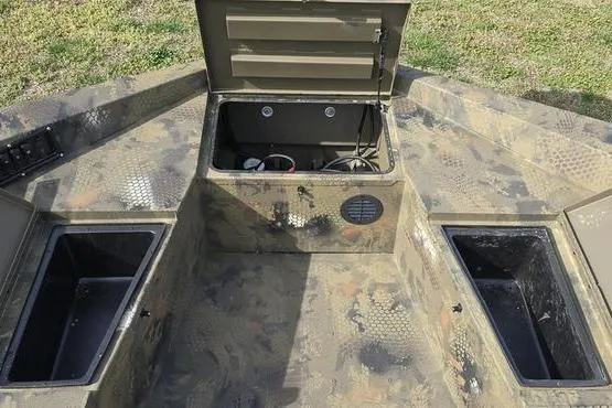 Slide: The Image of 2026 Havoc 1860 DBST boat interior with open storage compartments. - 3