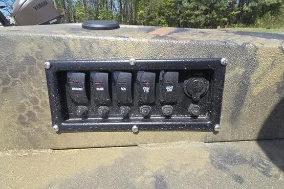 Slide: The Image of Control panel of 2026 Havoc 1860 DBST boat with multiple switches and rugged design. - 4