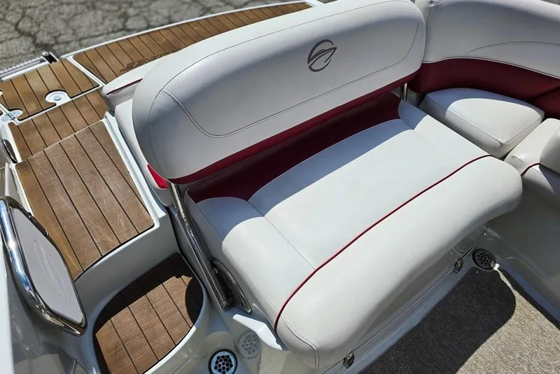 Slide: The Image of 2012 Crownline Eclipse E4 boat interior with white and red seating, wooden deck accents. - 10