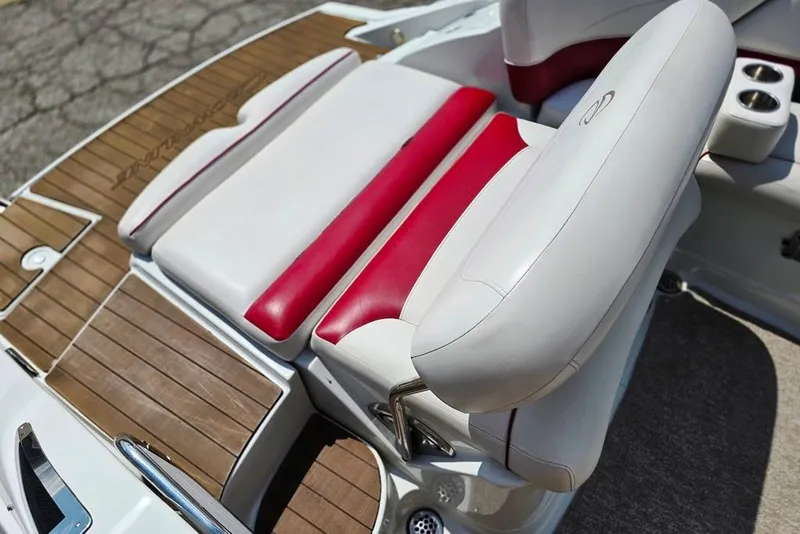 Slide: The Image of 2012 Crownline Eclipse E4 boat interior with red and white seating, wooden deck. - 11