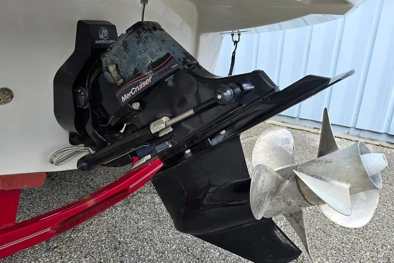 Slide: The Image of 2012 Crownline Eclipse E4 boat with MerCruiser Bravo Three outdrive and dual propellers. - 16