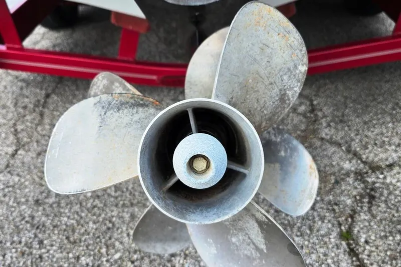 Slide: The Image of Close-up of a boat propeller from a 2012 Crownline Eclipse E4 on a textured surface. - 17