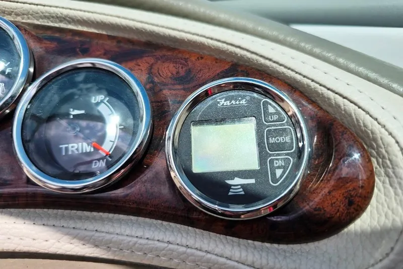 Slide: The Image of Dashboard of a 2012 Crownline Eclipse E4 boat with trim and mode controls. - 20