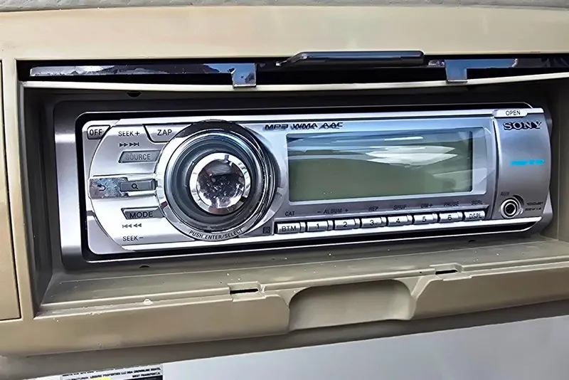 Slide: The Image of Sony stereo system in a 2012 Crownline Eclipse E4 boat dashboard. - 21