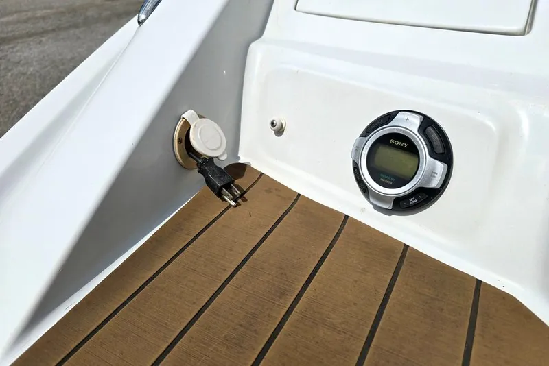 Slide: The Image of Crownline Eclipse E4 2012 boat dashboard with Sony stereo and power outlet. - 23