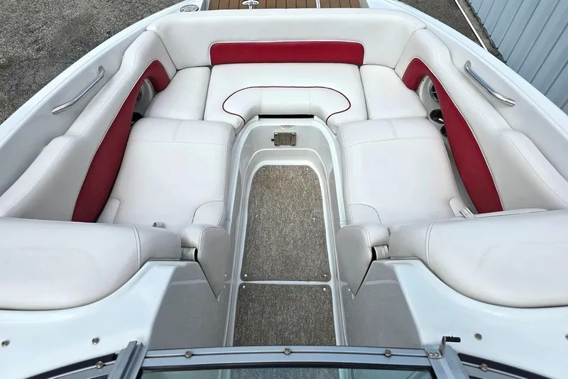 Slide: The Image of 2012 Crownline Eclipse E4 boat interior with white and red seating, spacious layout. - 4