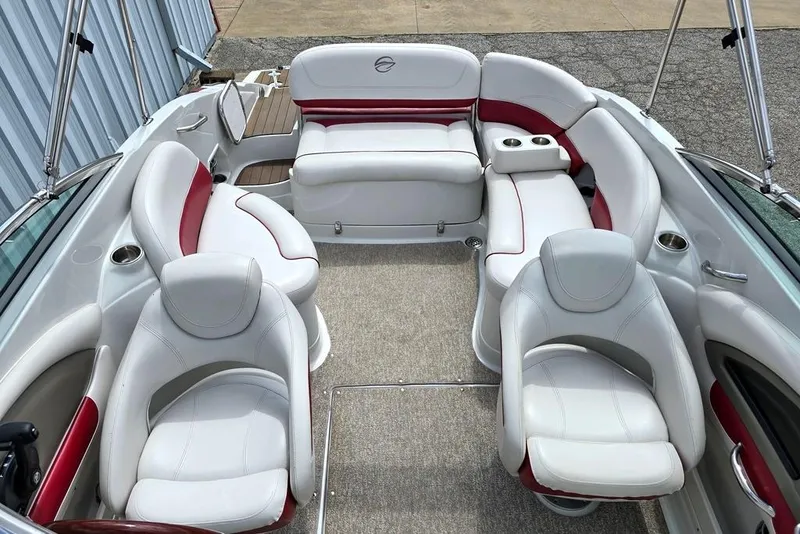 Slide: The Image of 2012 Crownline Eclipse E4 boat interior with white and red seating arrangement. - 6