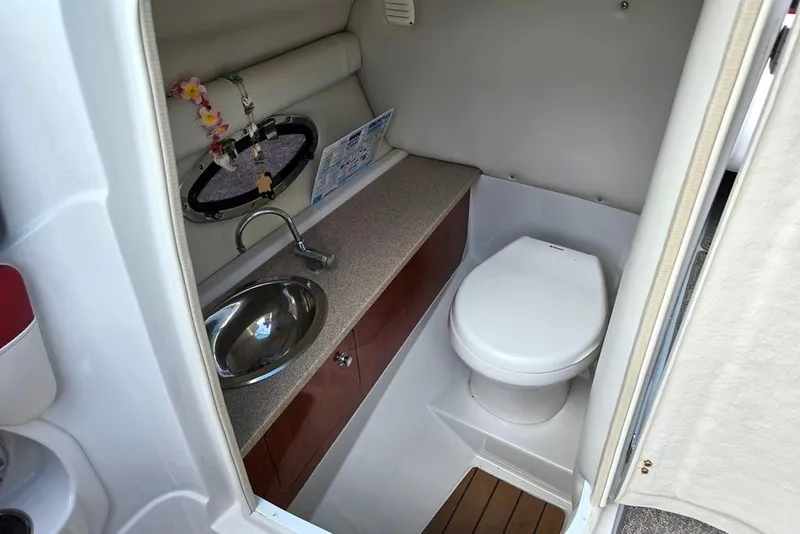 Slide: The Image of 2012 Crownline Eclipse E4 boat bathroom with sink, toilet, and countertop. - 8