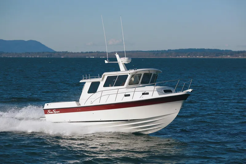 Slide: The Image of 2026 SeaSport Offshore 3000 cruising on open water under clear skies. - 11