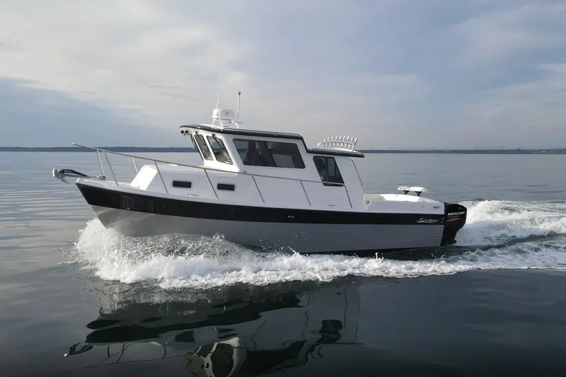 Slide: The Image of 2026 SeaSport Offshore 3000 cruising on calm waters under a cloudy sky. - 2