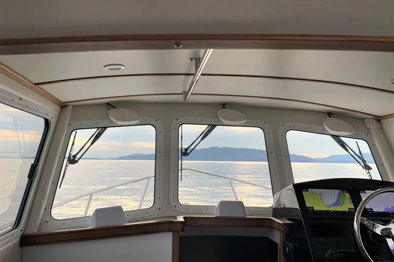 Slide: The Image of Interior view of 2026 SeaSport Offshore 3000 boat with scenic ocean horizon. - 21