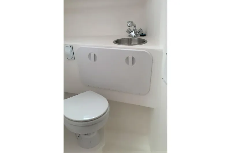 Slide: The Image of Compact bathroom in 2026 SeaSport Offshore 3000 boat with toilet and sink. - 6