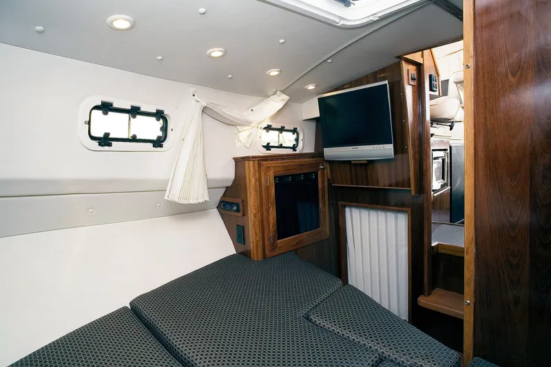 Slide: The Image of Interior of 2026 SeaSport Offshore 3000 boat with cozy cabin and modern amenities. - 7